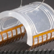 A close up photo of the tiny robot on a grey surface.